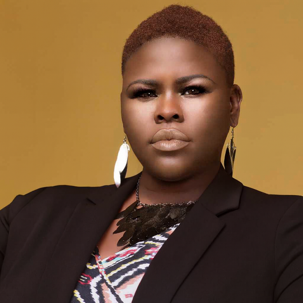 Chante Johnson in a black blazer posing in a professional setting